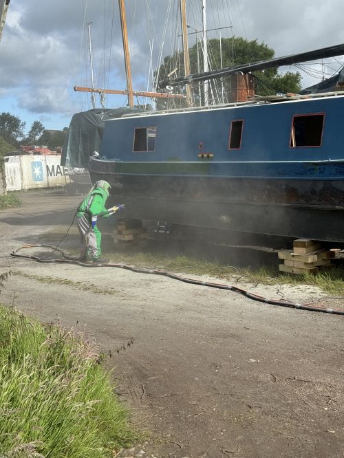 Click Here To Enlarge This Photo Of Sand Blasting a Narrow Boat