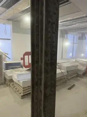 Click Here To Enlarge This Photo Of Sand Blasting Steel Columns at Burberry HQ